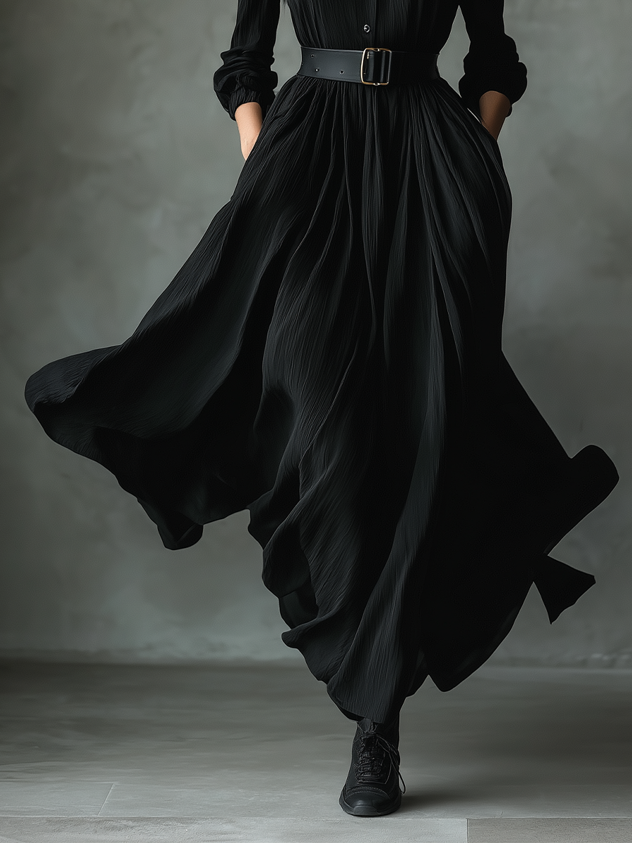 Black pleated maxi dress for women, stylish and flowy, featuring a fitted waist and elegant pleats, perfect for formal or casual occasions.