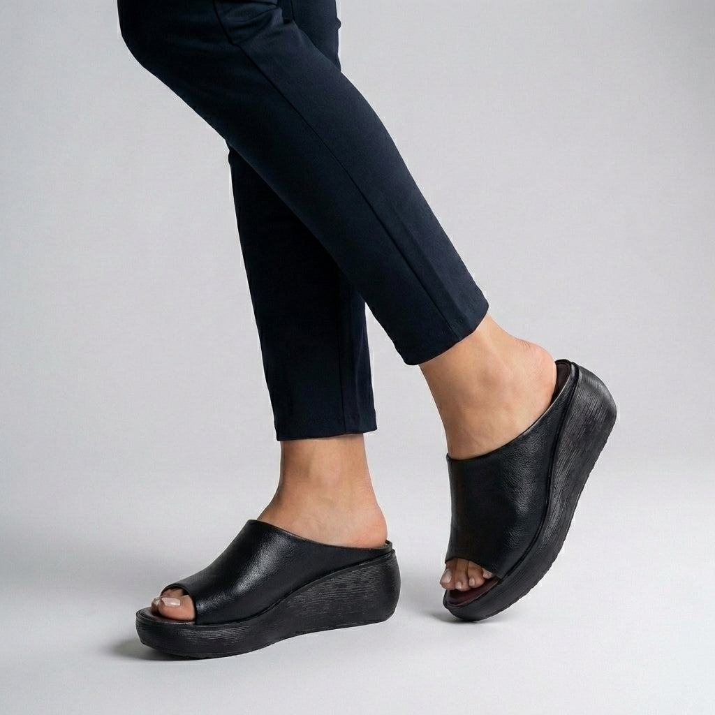 Black Tammy Bradley platform slide sandals with open toes, stylish and comfortable for women.