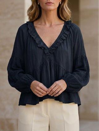 Black women's summer blouse with V-neck, long sleeves, denim fabric, and ruffle details, perfect for casual or dressy occasions