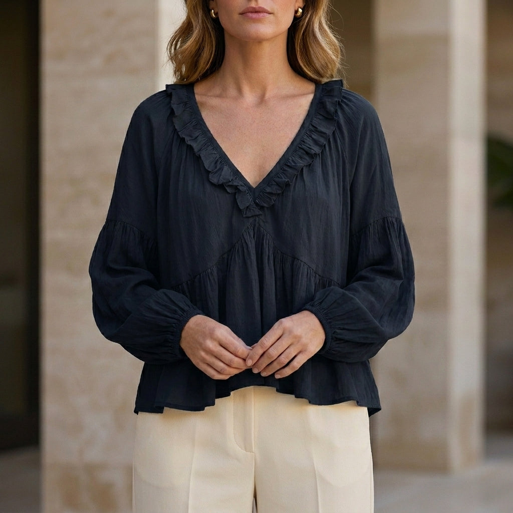 Black women's summer blouse with V-neck, long sleeves, denim fabric, and ruffle details, perfect for casual or dressy occasions