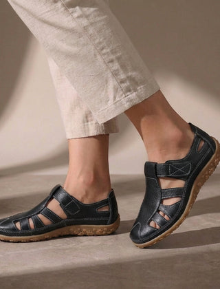 Black Tammy Bradley cutout fisherman sandals for women, showcasing stylish open-toe design and adjustable straps.