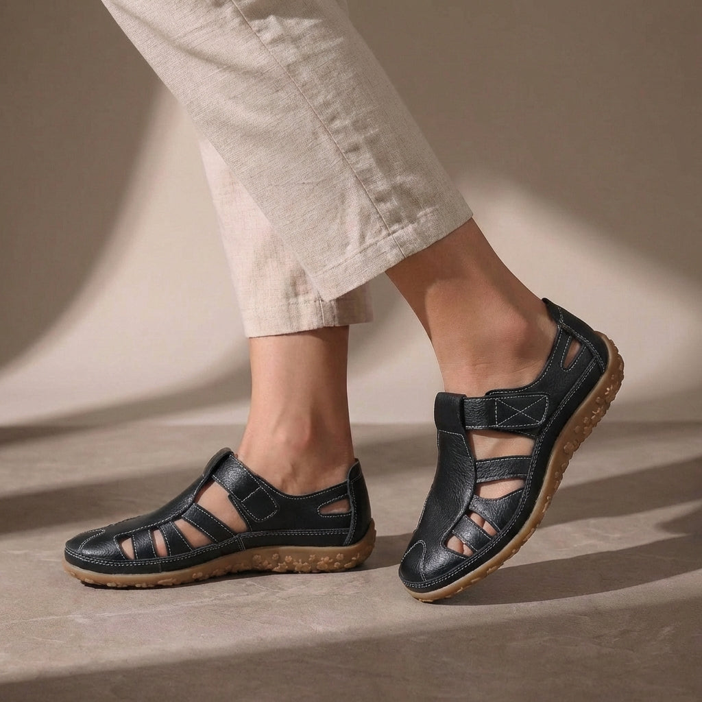 Black Tammy Bradley cutout fisherman sandals for women, showcasing stylish open-toe design and adjustable straps.
