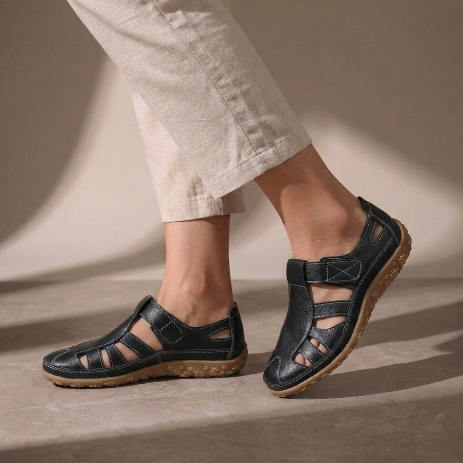 Black Tammy Bradley cutout fisherman sandals for women, showcasing stylish open-toe design and adjustable straps.