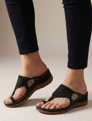 Black orthopedic floral embroidered wedge sandals for women with comfortable design and decorative flower embroidery.