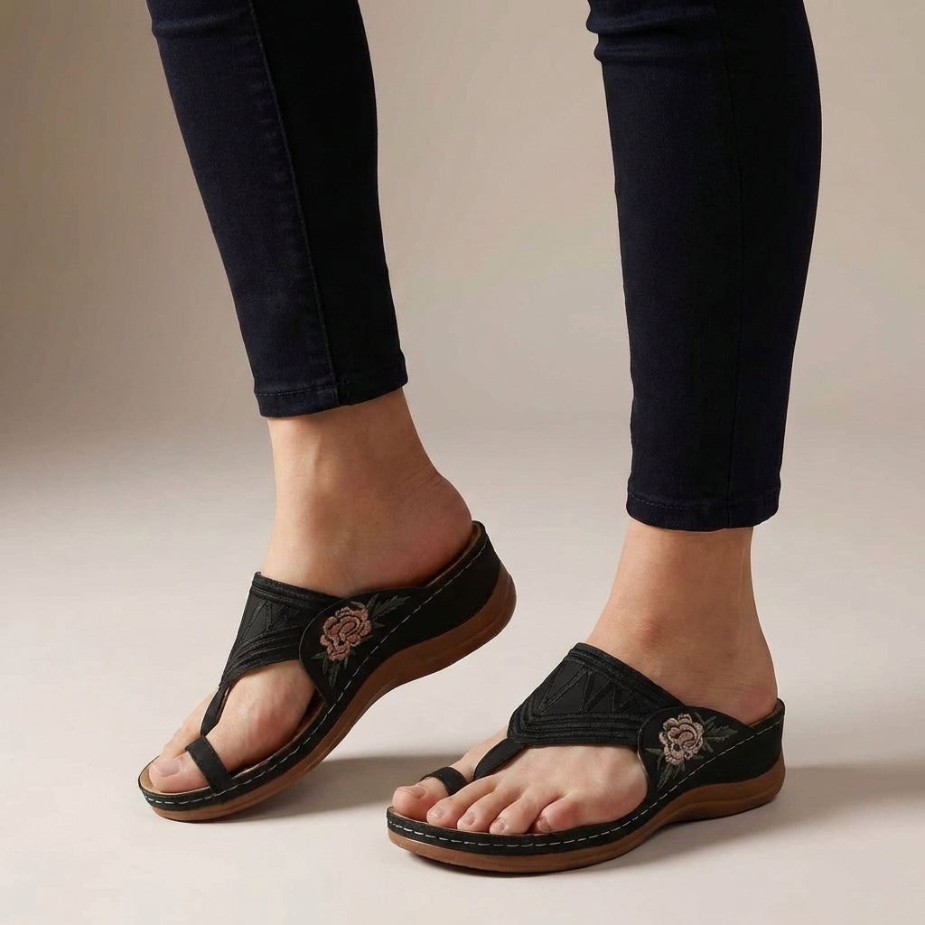Black orthopedic floral embroidered wedge sandals for women with comfortable design and decorative flower embroidery.