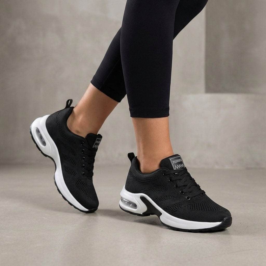 Black Tammy Bradley women's knit sneakers with breathable fabric, lightweight design, and comfortable casual style.