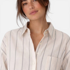 Lightweight women's striped button-down shirt with a relaxed fit, featuring vertical stripes and a classic collar.