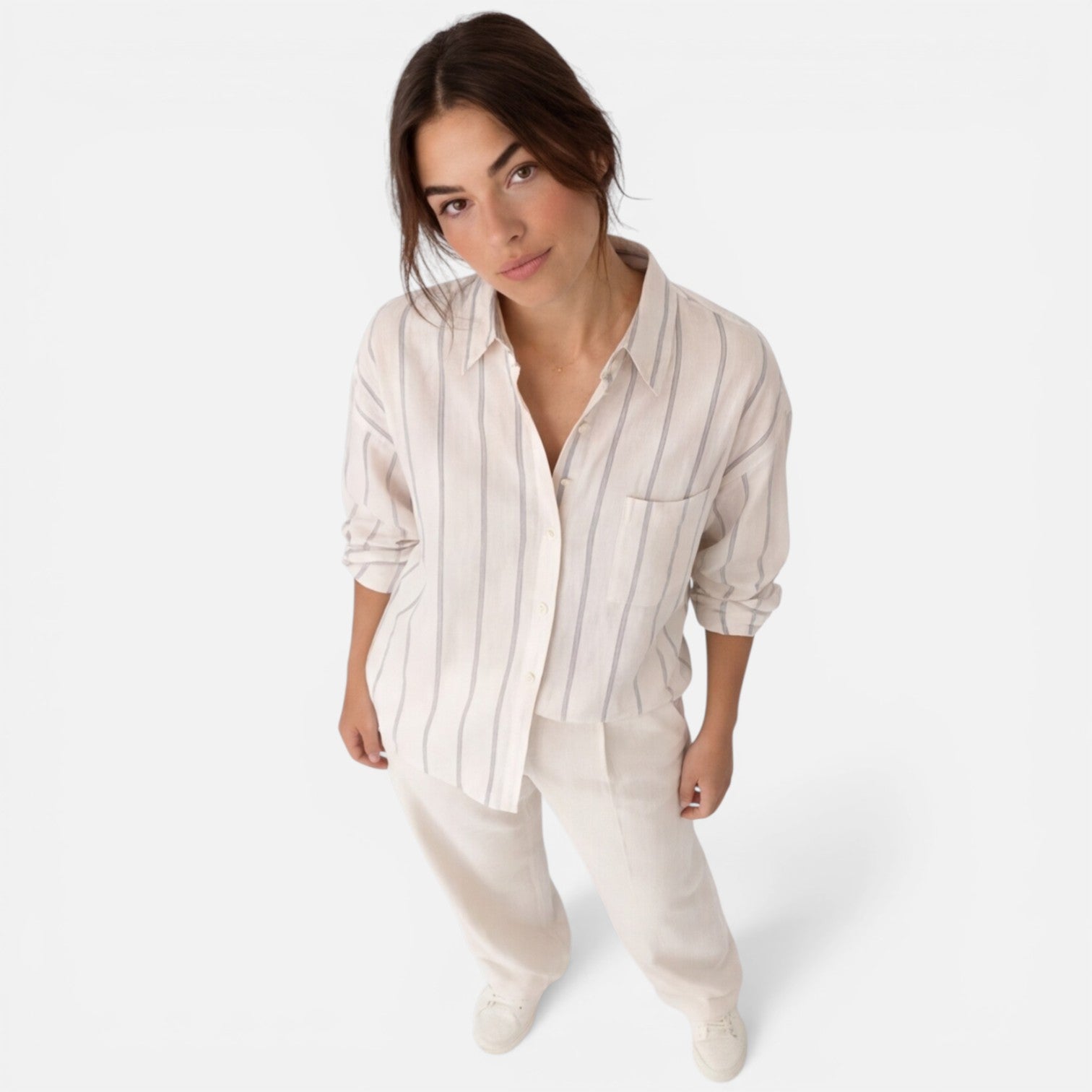 Lightweight women's striped button-down shirt with relaxed fit, long sleeves, and classic design, ideal for casual wear.