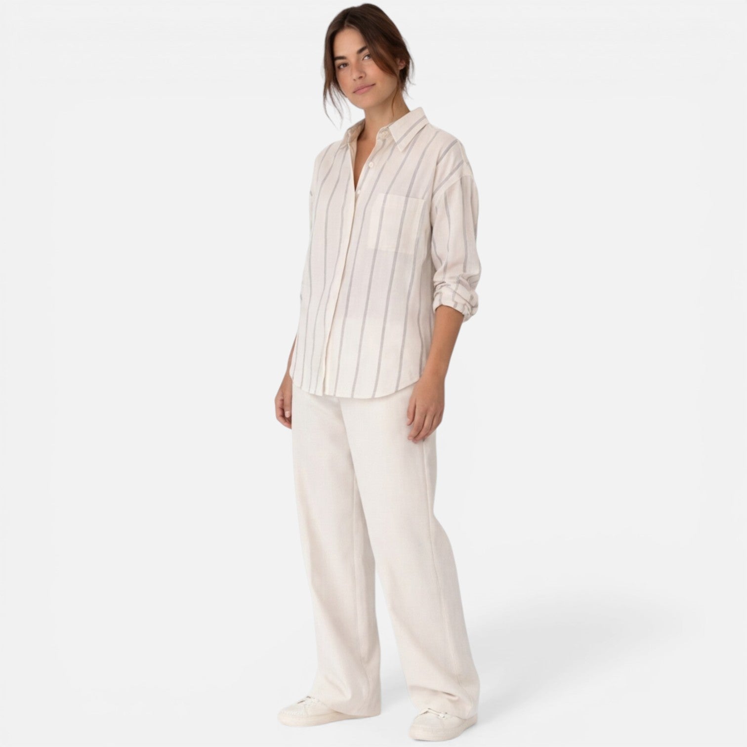 Women's striped button-down shirt with relaxed fit and lightweight fabric, featuring vertical stripes and a classic collar.