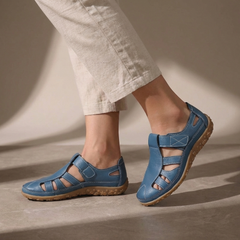 Blue Tammy Bradley cutout fisherman sandals for women, showcasing open-toe design and adjustable straps on a white background.