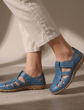 Blue Tammy Bradley cutout fisherman sandals for women, showcasing open-toe design and adjustable straps on a white background.