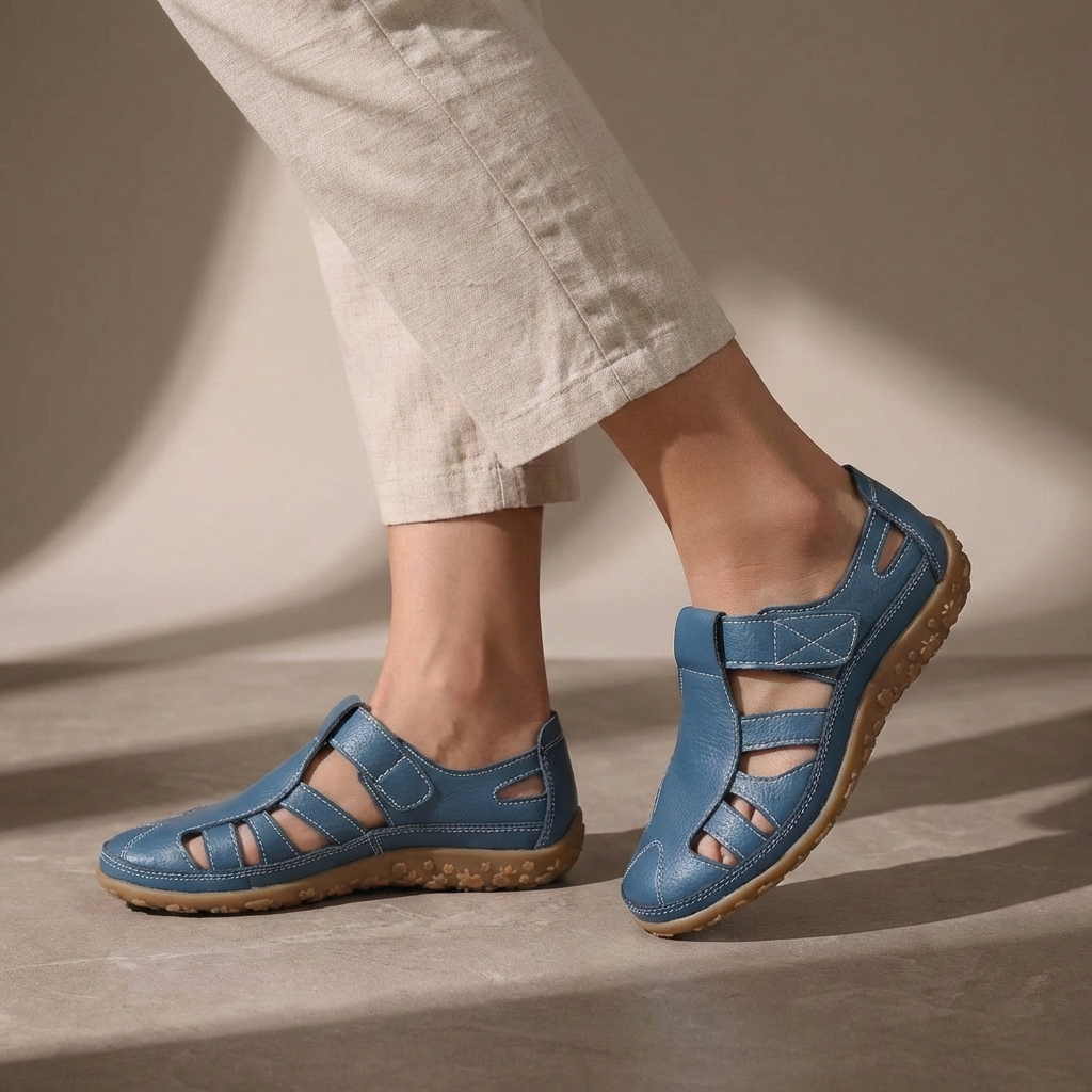 Blue Tammy Bradley cutout fisherman sandals for women, showcasing open-toe design and adjustable straps on a white background.