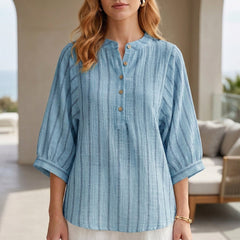 Blue striped linen summer blouse for women with button front, stylish and breathable top perfect for warm weather.