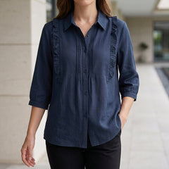 Blue denim summer blouse for women with ruffle details, stylish and lightweight top perfect for warm weather.