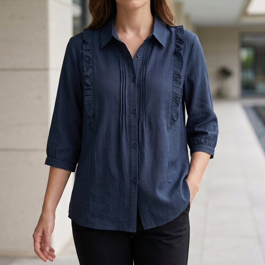 Blue denim summer blouse for women with ruffle details, stylish and lightweight top perfect for warm weather.