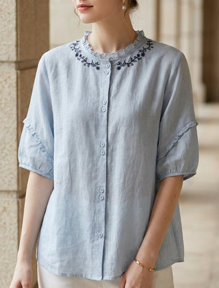 Blue linen summer blouse for women with ruffle details, stylish and breathable top perfect for warm weather.