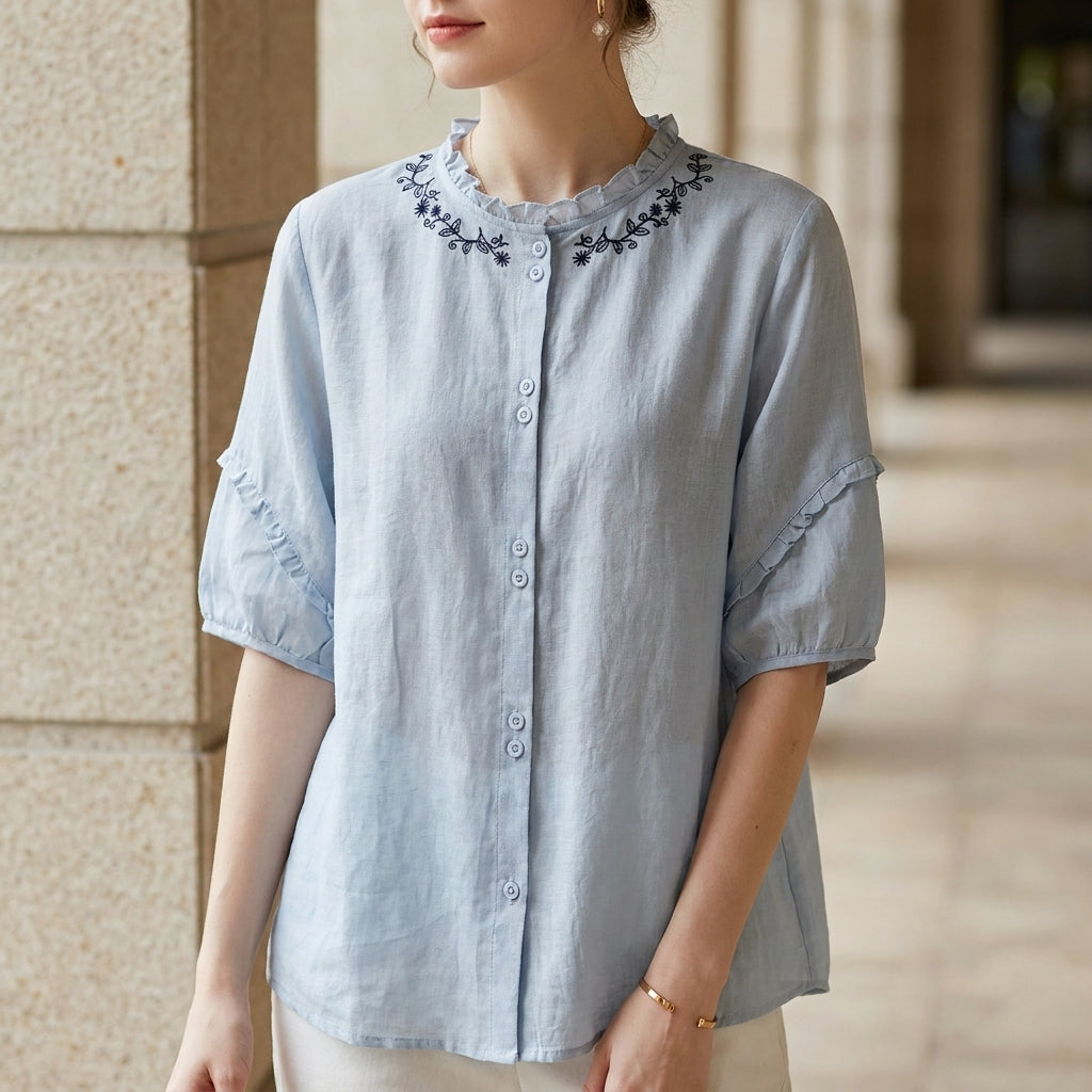 Blue linen summer blouse for women with ruffle details, stylish and breathable top perfect for warm weather.