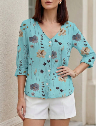 Blue floral V-neck summer blouse for women, denim button-front top with long sleeves, stylish and lightweight.