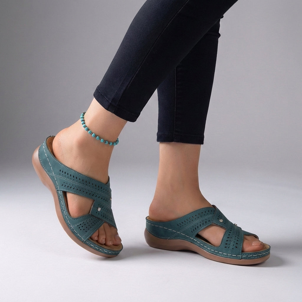 Blue orthopedic open toe wedge sandals with T-strap and rhinestones, featuring supportive design and stylish embellishments.