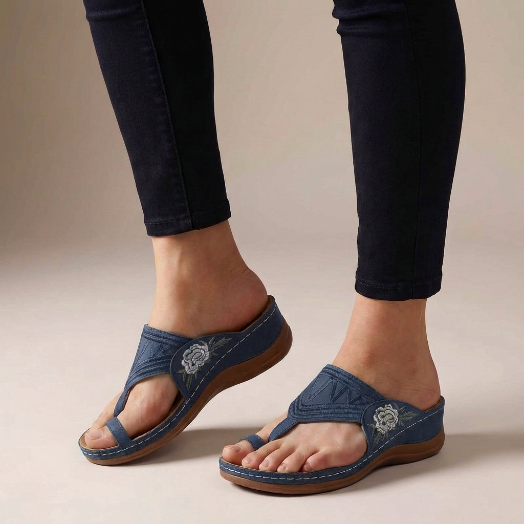 Blue orthopedic floral embroidered wedge sandals for women with supportive design and decorative flower details.