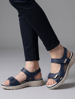 Blue orthopedic comfort fit sandals with chunky sole and adjustable straps, designed for support and casual wear.