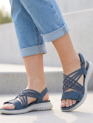 Blue orthopedic criss-cross strappy women's sandals with adjustable straps and supportive sole, designed for comfort and style.