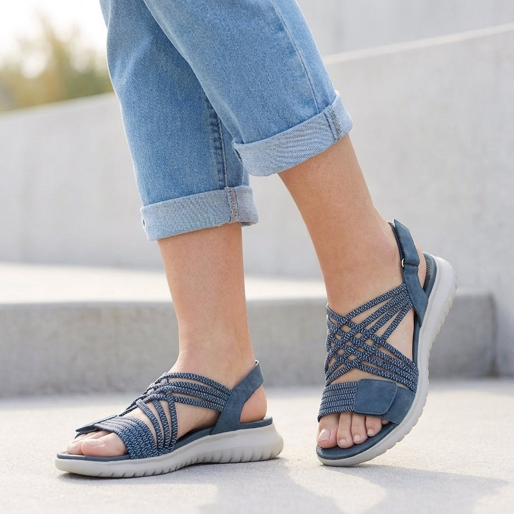 Blue orthopedic criss-cross strappy women's sandals with adjustable straps and supportive sole, designed for comfort and style.
