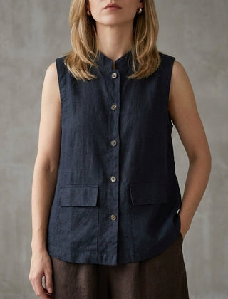 Blue sleeveless denim summer blouse for women with button front, stylish top perfect for casual warm-weather outfits.