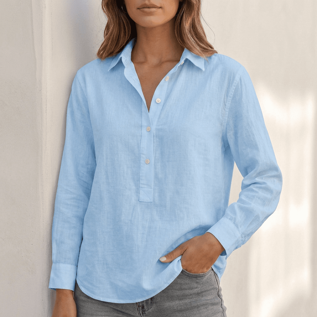 White linen v-neck relaxed-fit popover shirt for women by Tammy Bradley, displayed on a woman in a natural pose.