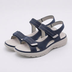Blue orthopedic comfort fit sandals with chunky sole and adjustable straps, designed for support and casual wear.
