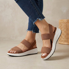 Brown women's orthopedic sandals with adjustable straps and flowy design, comfortable and supportive for everyday wear.