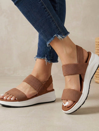 Brown women's orthopedic sandals with adjustable straps and flowy design, comfortable and supportive for everyday wear.