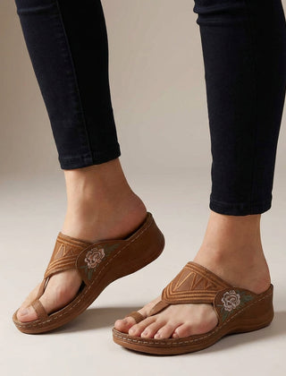 Brown orthopedic floral embroidered wedge sandals for women with supportive design and decorative flower embroidery on straps.