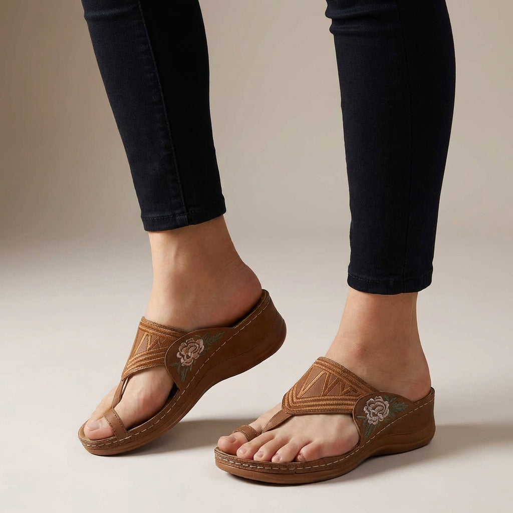 Brown orthopedic floral embroidered wedge sandals for women with supportive design and decorative flower embroidery on straps.