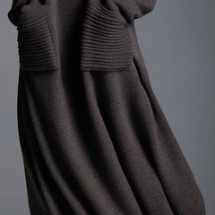 Brown knit maxi dress for women, featuring a flowing design and long sleeves, perfect for casual or elegant occasions.