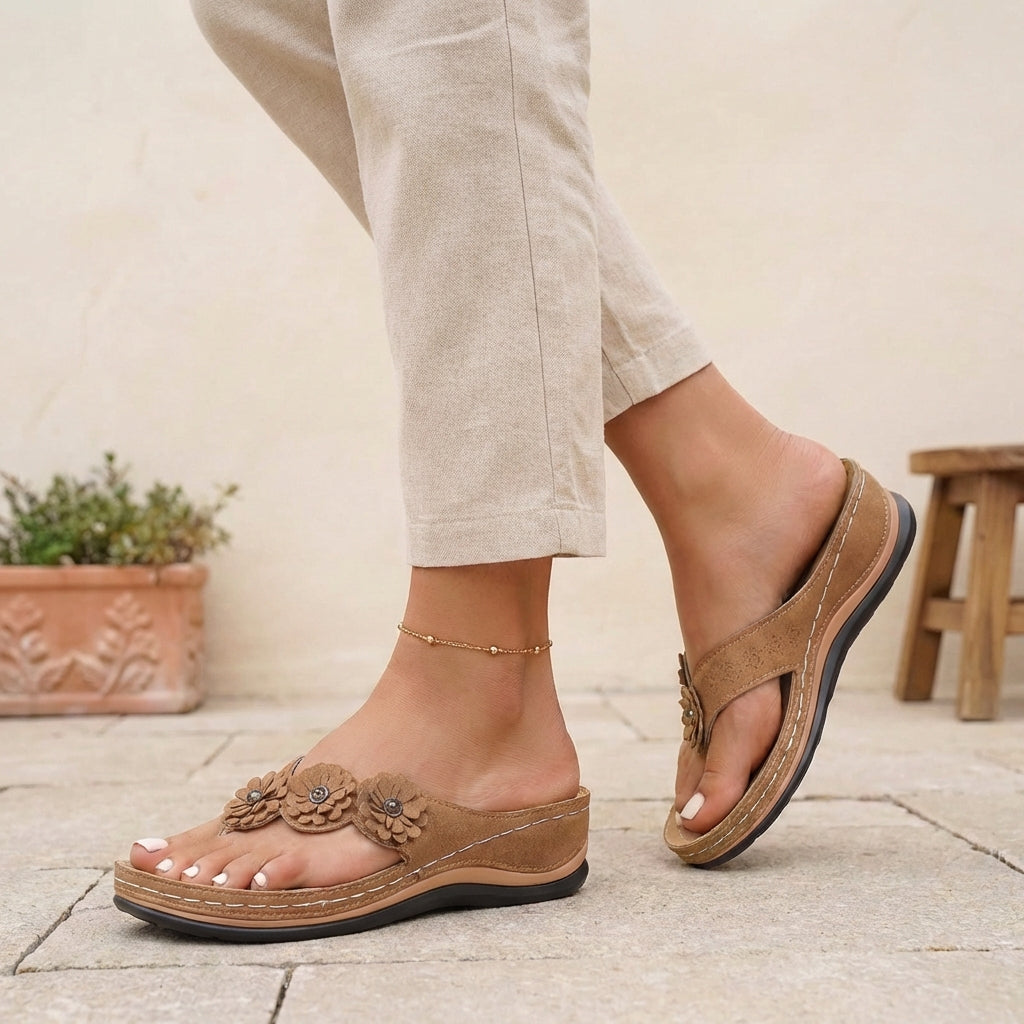 Brown floral appliqué wedge thong sandals for women by Tammy Bradley, featuring decorative flower details and comfortable wedge heel.