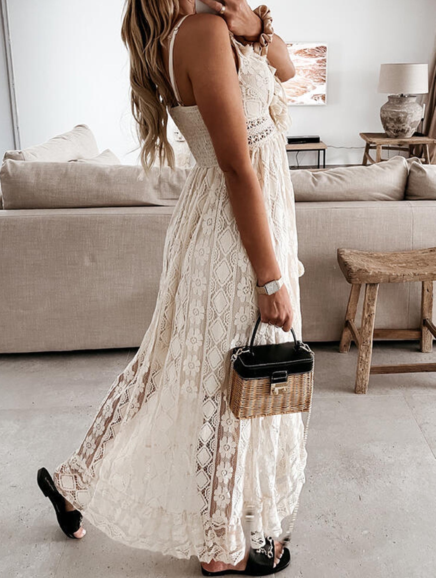 White lace strappy long dress with resort style design, featuring intricate details and flowing fabric, perfect for elegant occasions.
