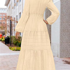 White V-neck pleated waist tiered long-sleeved dress by My Store, showing the flowing fabric and elegant design.