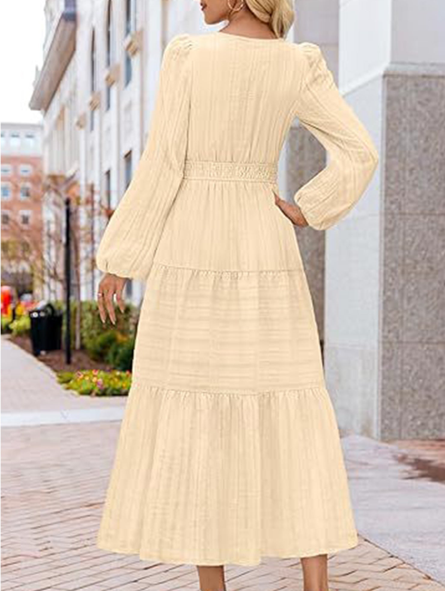 White V-neck pleated waist tiered long-sleeved dress by My Store, showing the flowing fabric and elegant design.