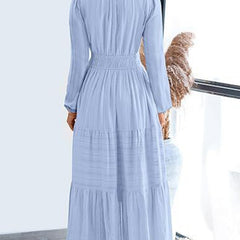 Light blue V-neck pleated waist tiered long-sleeved dress with a flowing silhouette, stylish and elegant for any occasion.