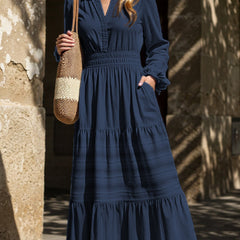 White V-neck pleated waist tiered long-sleeved dress with a flowing silhouette, stylish and elegant.