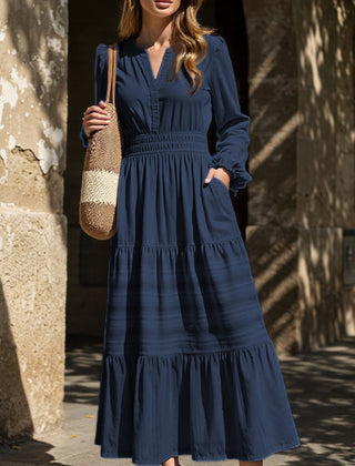 White V-neck pleated waist tiered long-sleeved dress with a flowing silhouette, stylish and elegant.