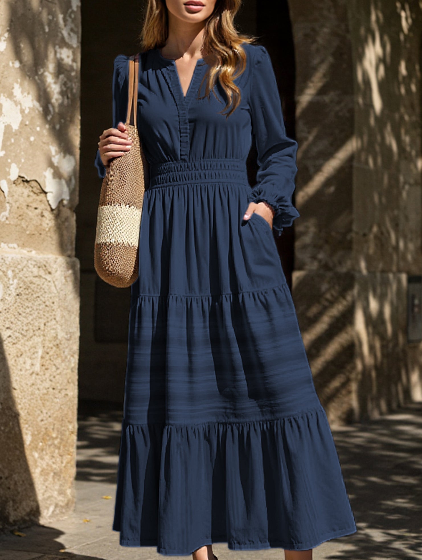 White V-neck pleated waist tiered long-sleeved dress with a flowing silhouette, stylish and elegant.