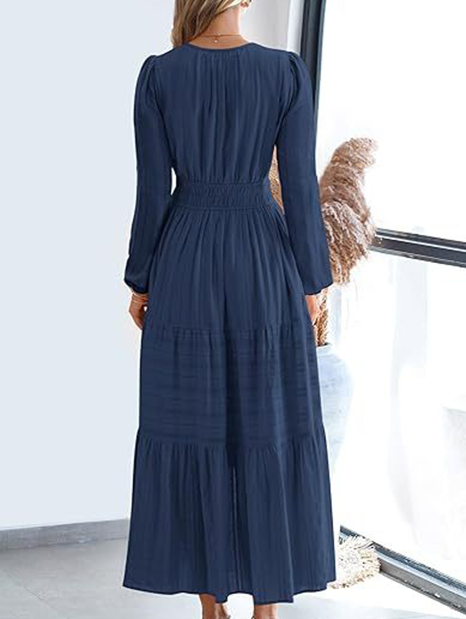 White V-neck pleated waist tiered long-sleeved dress with a relaxed fit, stylish and elegant for any occasion.