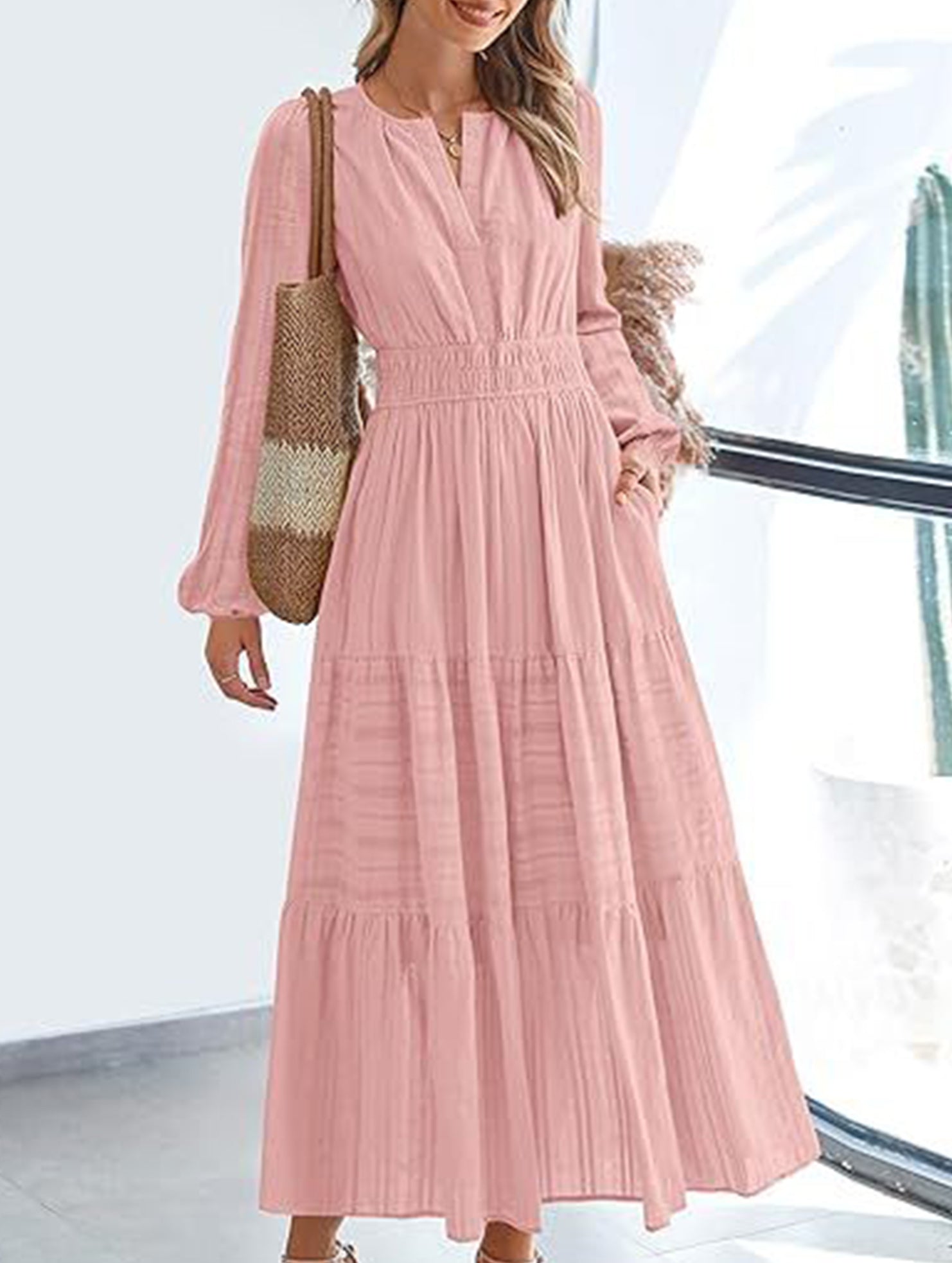 White V-neck pleated waist tiered long-sleeved dress with a flowy silhouette and feminine design.