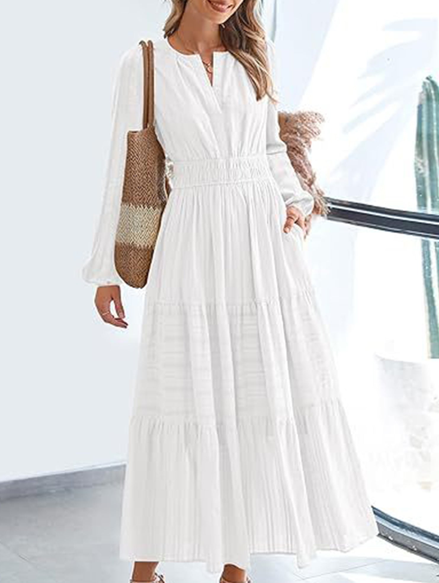 White V-neck pleated waist tiered long-sleeved dress with a flowing silhouette, stylish and elegant for various occasions.