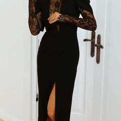 Black openwork dress with lace slit and cinched waist by Tammy Bradley, featuring intricate lace details and elegant design.