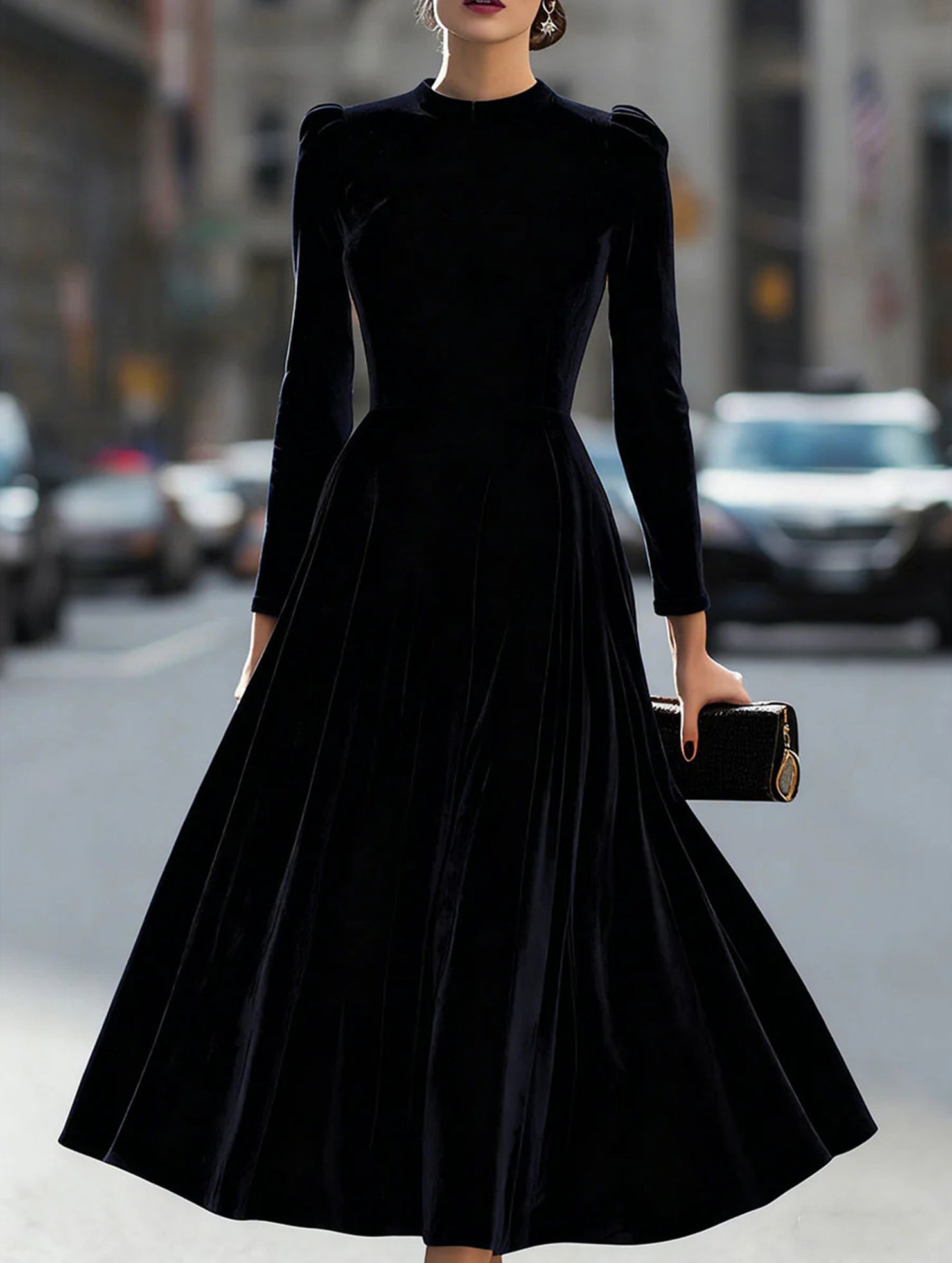 Black velvet round neck long-sleeved dress by Tammy Bradley, featuring a elegant fit and smooth fabric, displayed on a hanger.