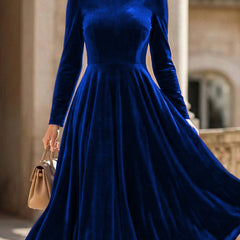 Blue velvet round neck long-sleeved dress by Tammy Bradley, featuring a stylish and elegant design.