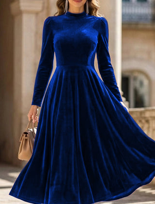 Blue velvet round neck long-sleeved dress by Tammy Bradley, featuring a stylish and elegant design.